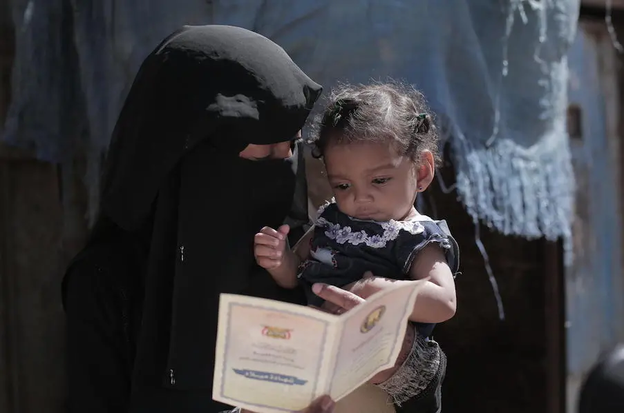Souad holds her 9-month-old daughter, Nour, who was treated for acute malnutrition at a UNICEF-supported health center in Sana'a, Yemen. Souad holds her 9-month-old daughter, Nour, who was treated for acute malnutrition at a UNICEF-supported health center in Sana'a, Yemen.