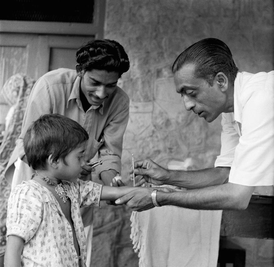 A girl is vaccinated against smallpox in India by a UNICEF-supported health worker circa 1961.