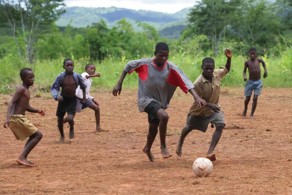Boys play soccer at a settlement in the village of Nyamukwara near the Mozambican border. 