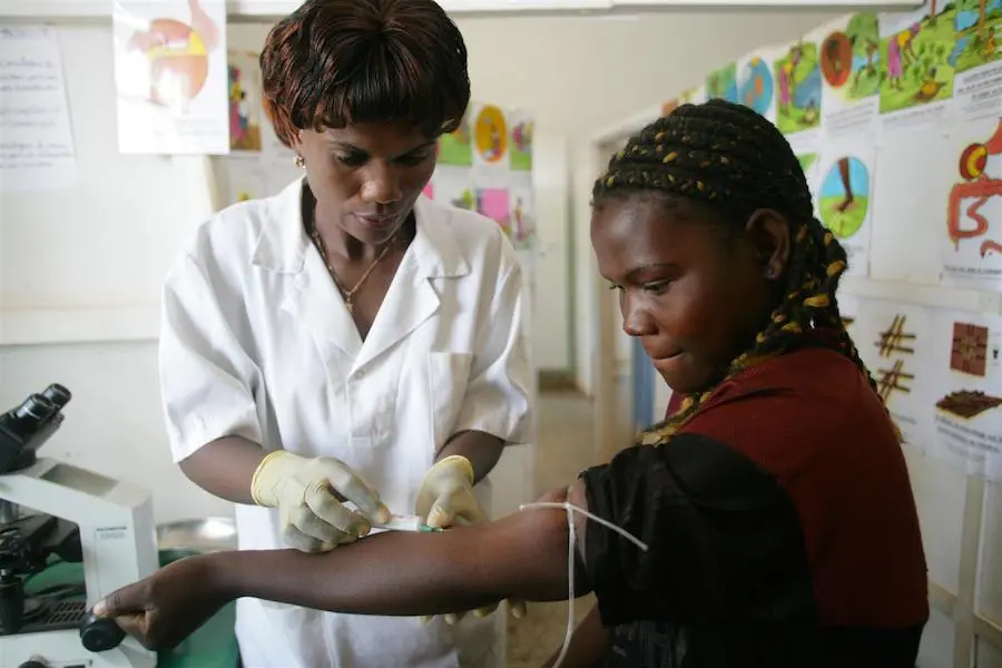 A pregnant woman is tested for HIV at a UNICEF-supported health center in Likasi, a town in southeastern Katanga province, Democratic Republic of the Congo. A pregnant woman is tested for HIV at a UNICEF-supported health center in Likasi, a town in southeastern Katanga province, Democratic Republic of the Congo.
