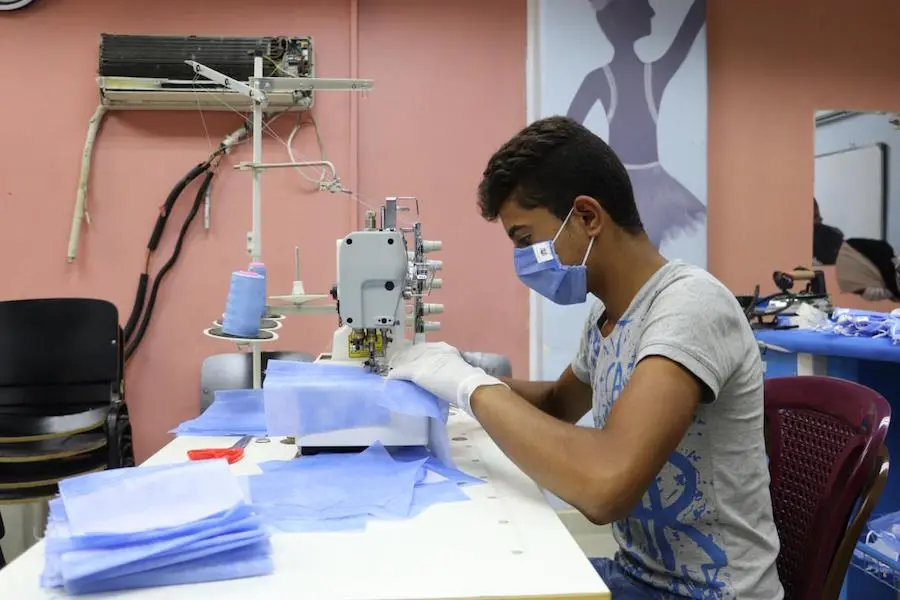 Majd, 17, is a trainee in a sewing course at the UNICEF-supported youth center in Jaramana, rural Damascus, Syria. 