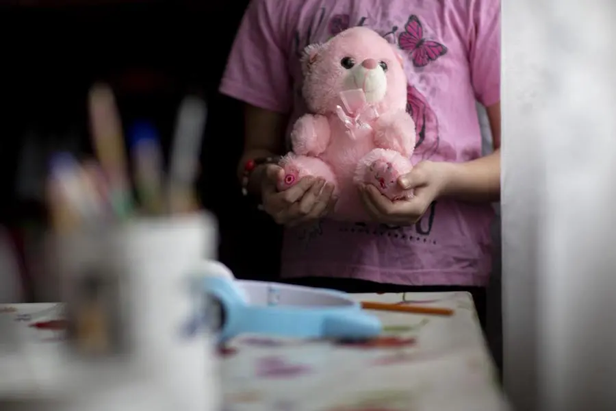 In eastern Ukraine, 9-year-old Daryna says her teddy bear is one of the things she would take with her if her family has to evacuate. In eastern Ukraine, 9-year-old Daryna says her teddy bear is one of the things she would take with her if her family has to evacuate.
