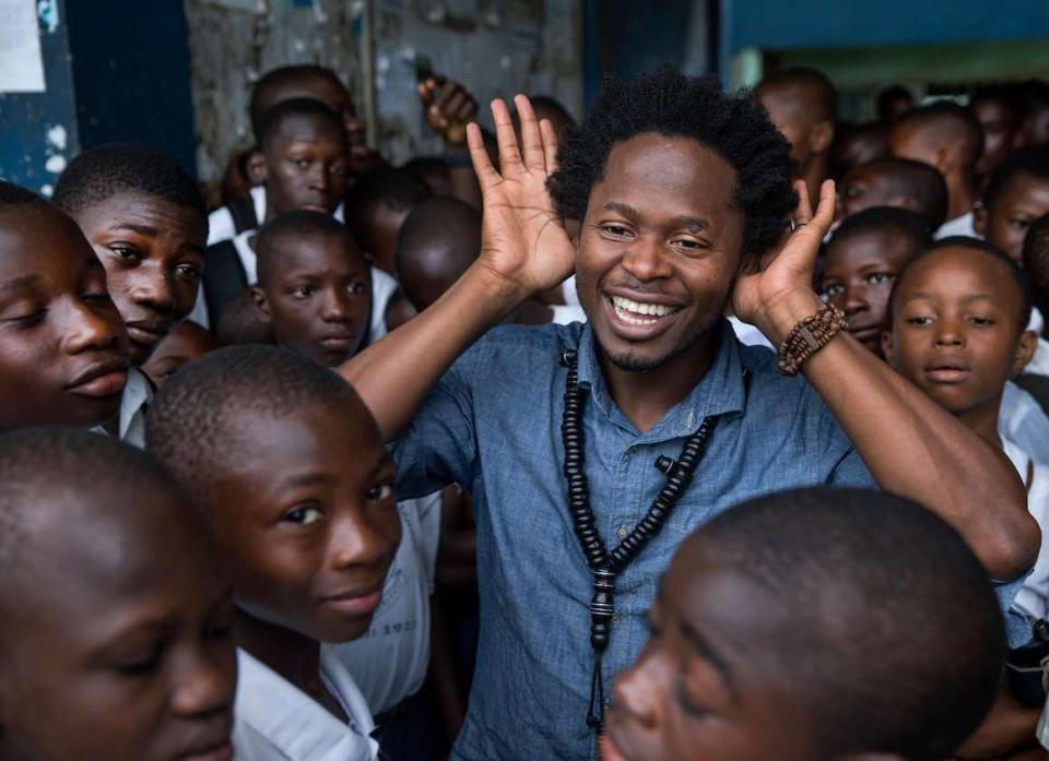 Former child soldier, and author Ishmael Beah visiting the school he studied in as a child July 1, 2016 in Freetown, Sierra Leone.