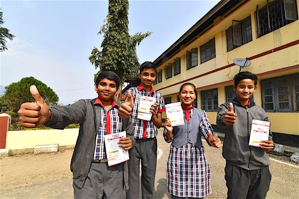 During one of the world’s largest mass immunization campaigns, spearheaded by UNICEF and partners, students in India show their proof of measles/rubella vaccination.
