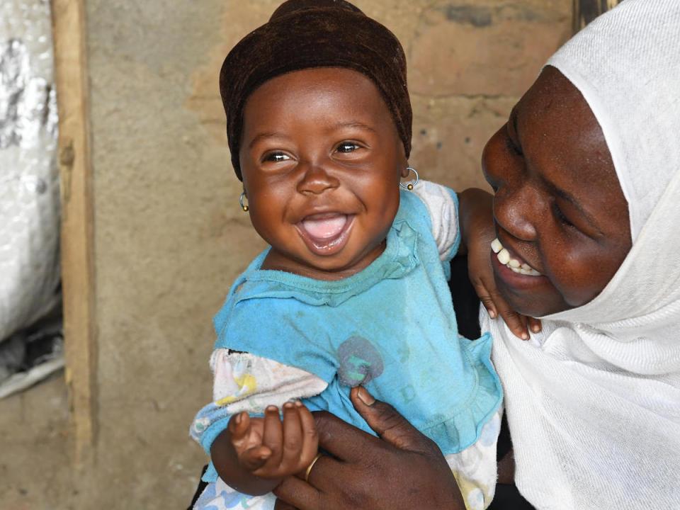 In March 2019, a mother cuddles her little girl in the village of Alibeit in southern Chad.