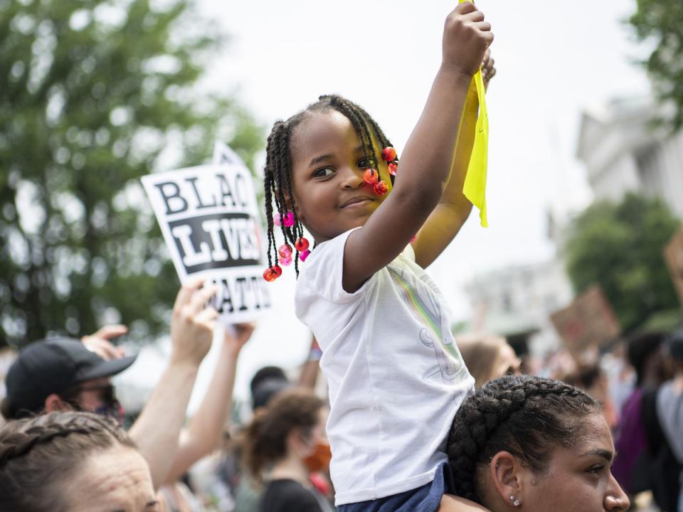 Demonstrators are seen on Constitution Avenue while marching to Freedom Plaza from Capitol Hill to honor George Floyd and all victims of racial injustice on Saturday, June 6, 2020. 