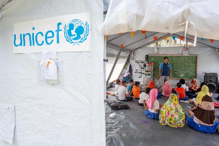 On September 16, 2019, in Maguindanao, Mindanao, the Philippines, children learn in a new high-performance UNICEF tent that makes up part of Kulasi Elementary School.