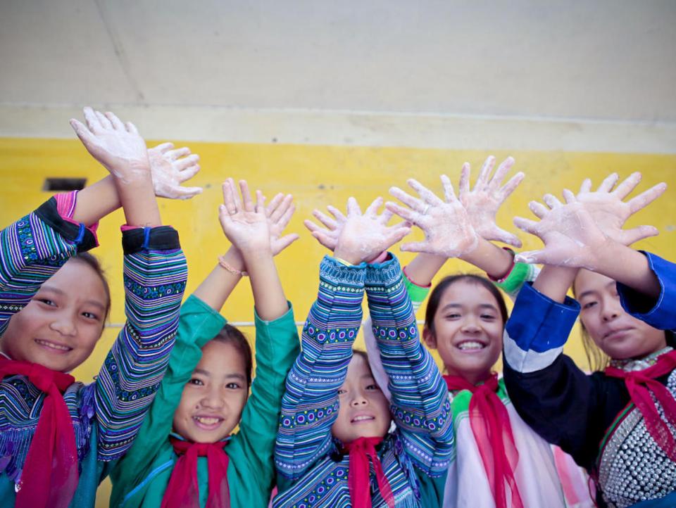 Children from the UNICEF-supported Muong Khuong Boarding School in Lao Cai, Vietnam enjoy washing their hands with soap and clean water.