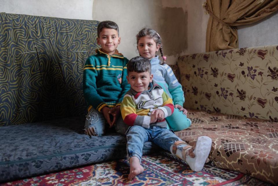 Siblings Anwar, 9, Nada, 6, and Mohammad, 3, are growing up in war-torn Syria. A UNICEF-supported cash transfer program helps their family pay for winter clothes and other necessities. 
