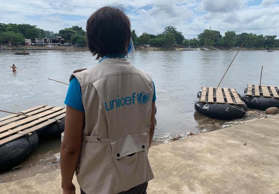 A member of UNICEF's staff stands by the Suchiate River at the Mexico-Guatemala border, a popular crossing point along the migration route.
