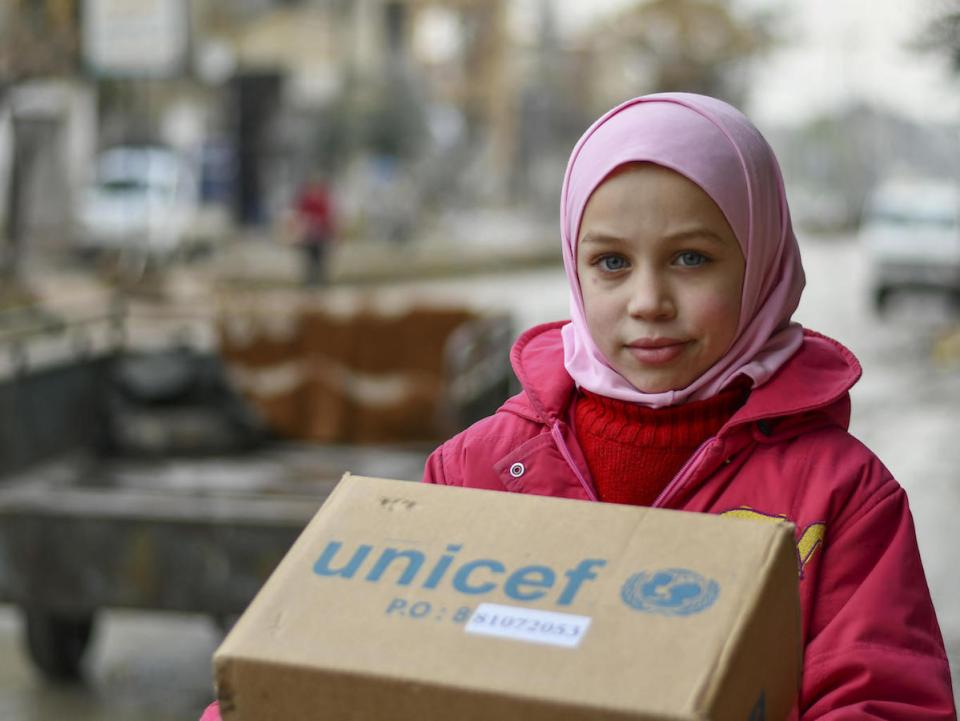 Najwa, 10, received new winter clothes from UNICEF in Hammourieh, rural Damascus in the Syrian Arab Republic.