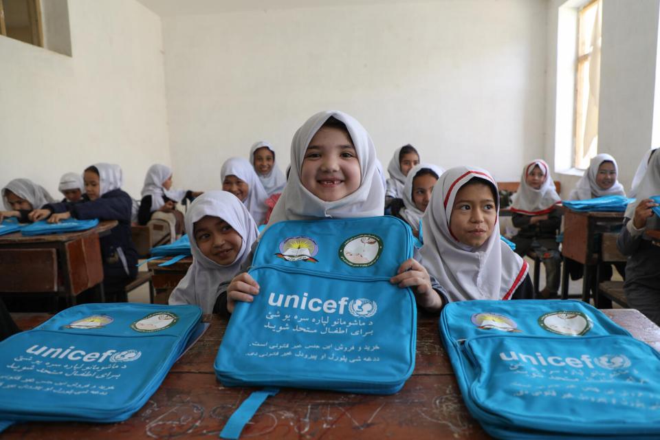 Girls at an elementary school in Mazar, Afghanistan received UNICEF schoolbags and learning supplies. 