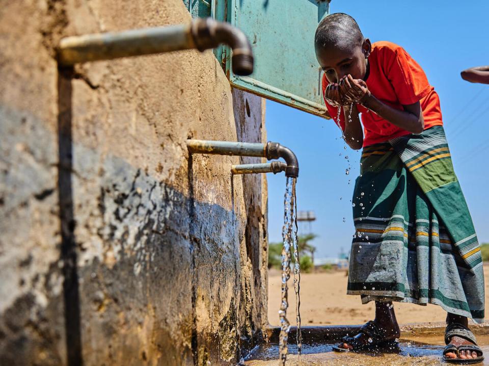 A child drinks water piped from a borehole rehablitated by UNICEF in Garissa County, Kenya. 