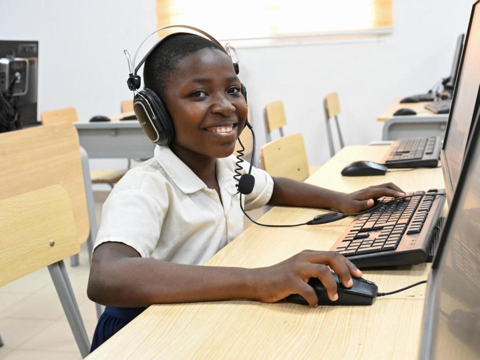 A student works in the computer room at Lycée Mamie Adjoua in Bingerville, southern Côte d'Ivoire on February 11, 2022. 