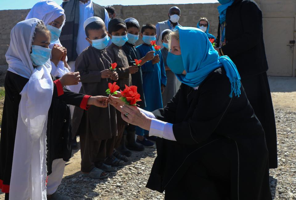 In Afghanistan on Feb. 24, 2022, UNICEF Executive Director Catherine Russell is greeted by students at a UNICEF-supported community-based school in Kandahar’s Dand district.