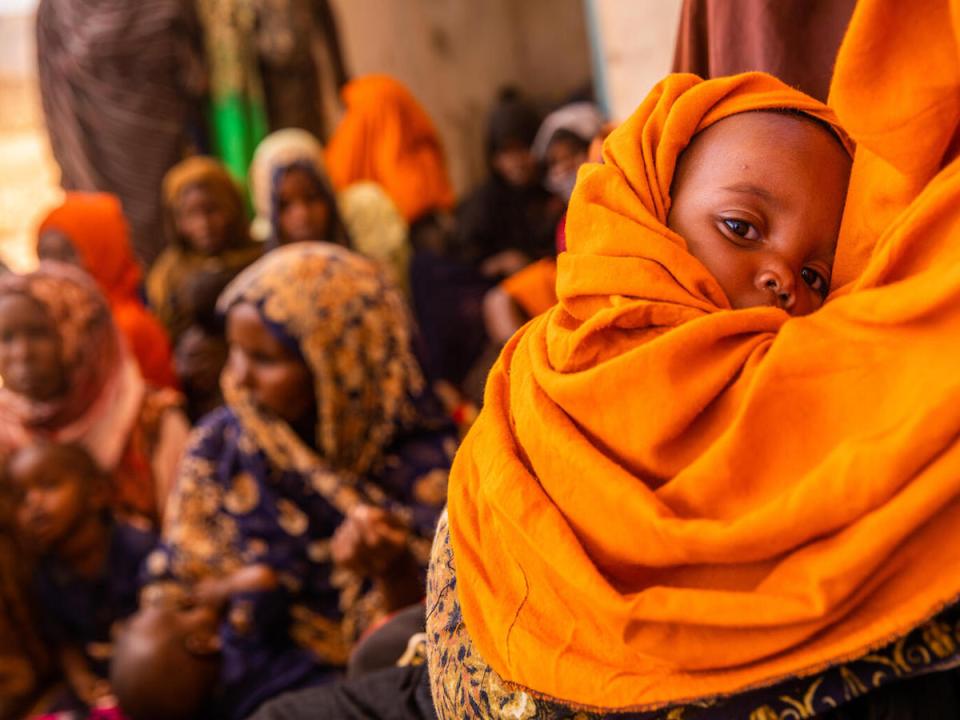 On April 11, 2022, a mother and a baby wait at a health post in Ba’adley, IDP Site, Shabelle Zone, Somali Region, Ethiopia.