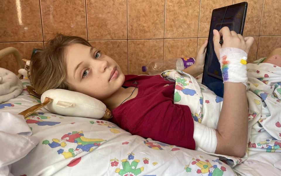 11-year-old Yana, who lost two legs during a missile attack at Kramatorsk railway station, recovers at a hospital in Lviv, Ukraine.