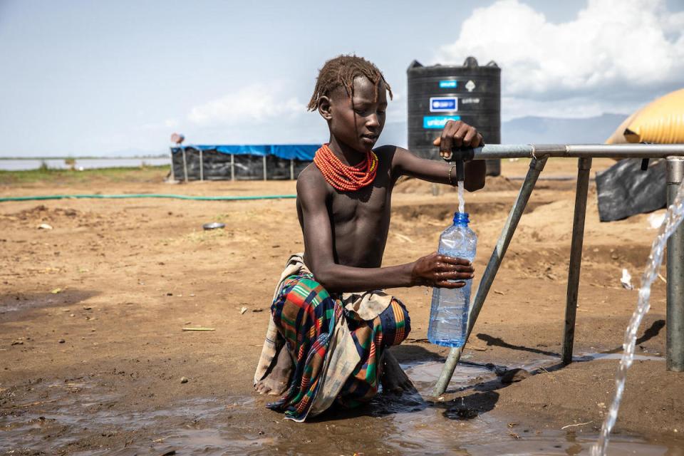  Yer, 11, accesses safe water from a new UNICEF-installed system at the Sirmeret  camp for internally displaced families in the SNNP region of Ethiopia.