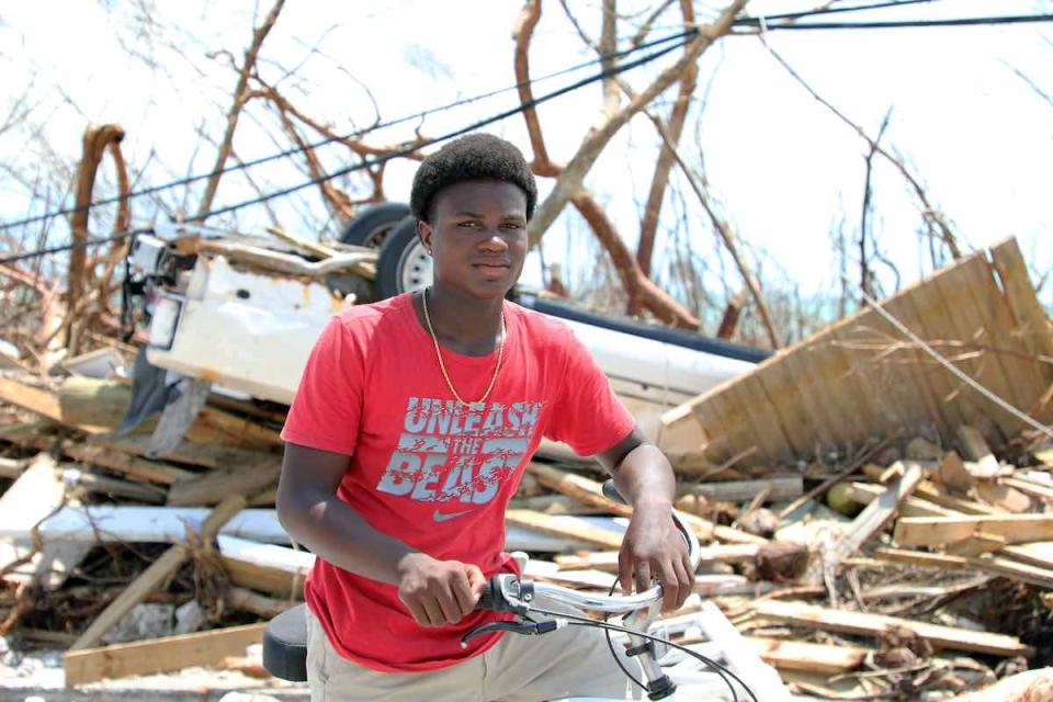 On 6 September 2019, Benson Etienne, 15, rides his bicycle around the hurricane-hit Marsh Harbour, in Abaco Island. He was with his family in a two-story building when Hurricane Dorian slammed Abaco Island for 40 hours. “Now everything is destroyed, every
