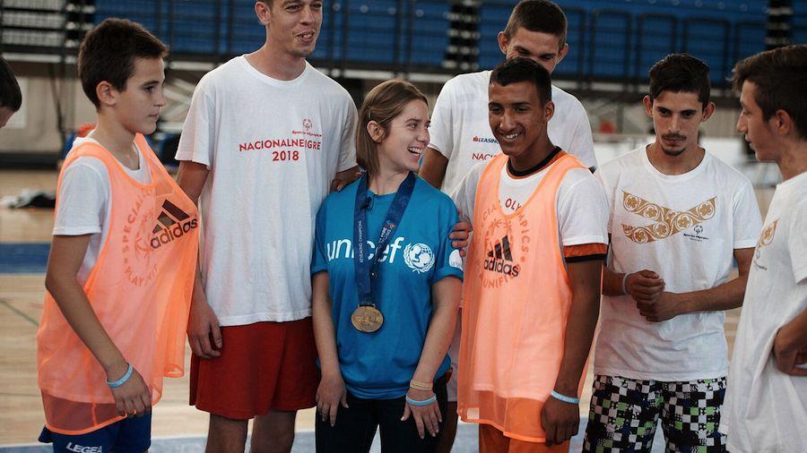 Lucy Meyer, an advocate for children with disabilities, visiting with Special Olympics youth athletes in Montenegro.
