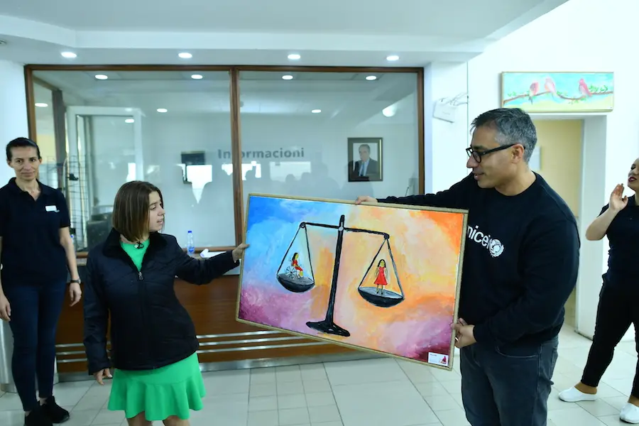 Lucy Meyer is given a painting as a thank you for her efforts on behalf of children with disabilities. Lucy Meyer is given a painting as a thank you for her efforts on behalf of children with disabilities.