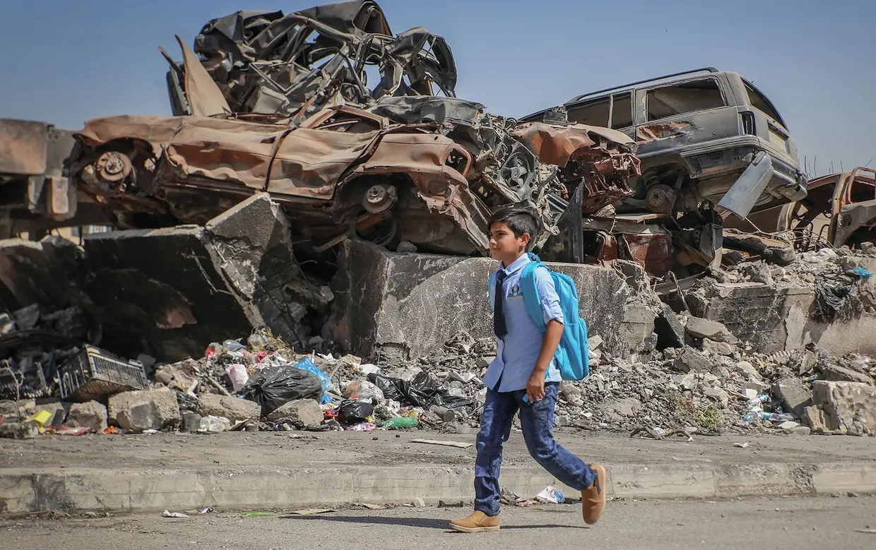 On September 26, 2018, in West Mosul, Iraq, neighbors Ali, 11, and Farah (not pictured), 13, attend the UNICEF-supported Ithar School which runs a shift for boys and a shift for girls. During the last war, both children dropped out of school. "I feel sad when I see the destruction on my way to school but I am happy because we have returned to school this year,” says Ali “I wish we never see those days again.” “There is no life without school,” Farah says. She likes math and wants to become an engineer.
