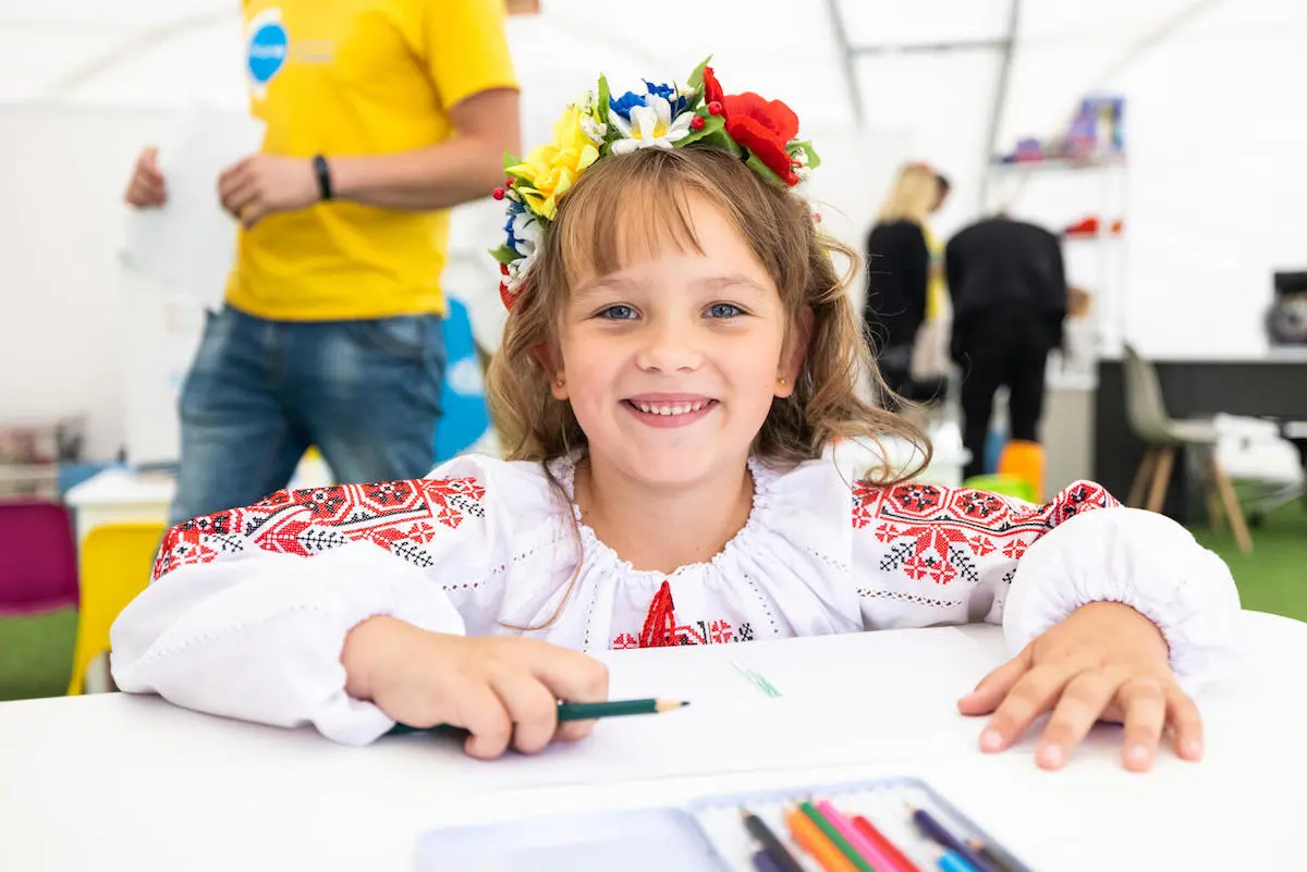 On Sept. 1, 2022, in Lviv, Ukraine, a girl draws at a Spilno center set up by UNICEF and partners to provide a welcoming place where children affected by the war can make friends, play, learn and connect with support services.