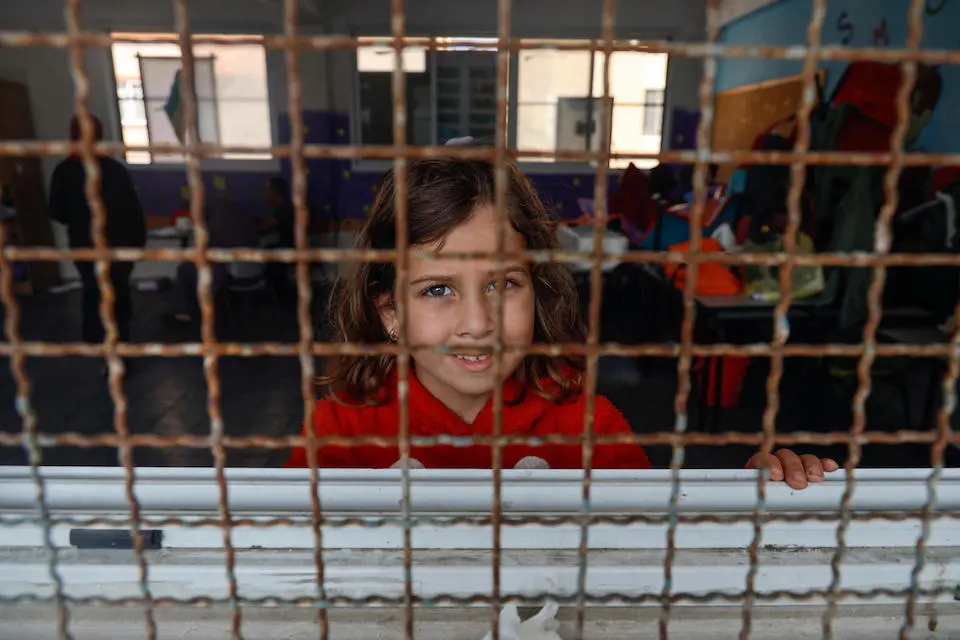 Emilia, 6, stands in a UNRWA (United Nations Relief and Works Agency for Palestine Refugees in the Near East) school being used as a shelter in Gaza City.