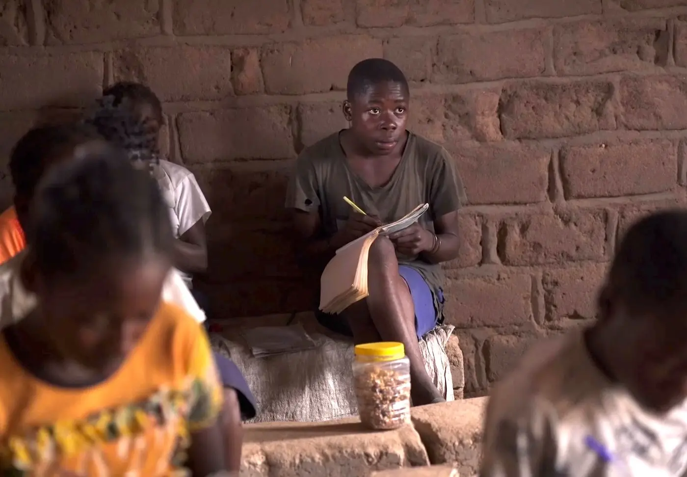 Delphin of Kampyempye village, Tanganyika province, eastern DRC, is back at school and studying hard after having been displaced by conflict.