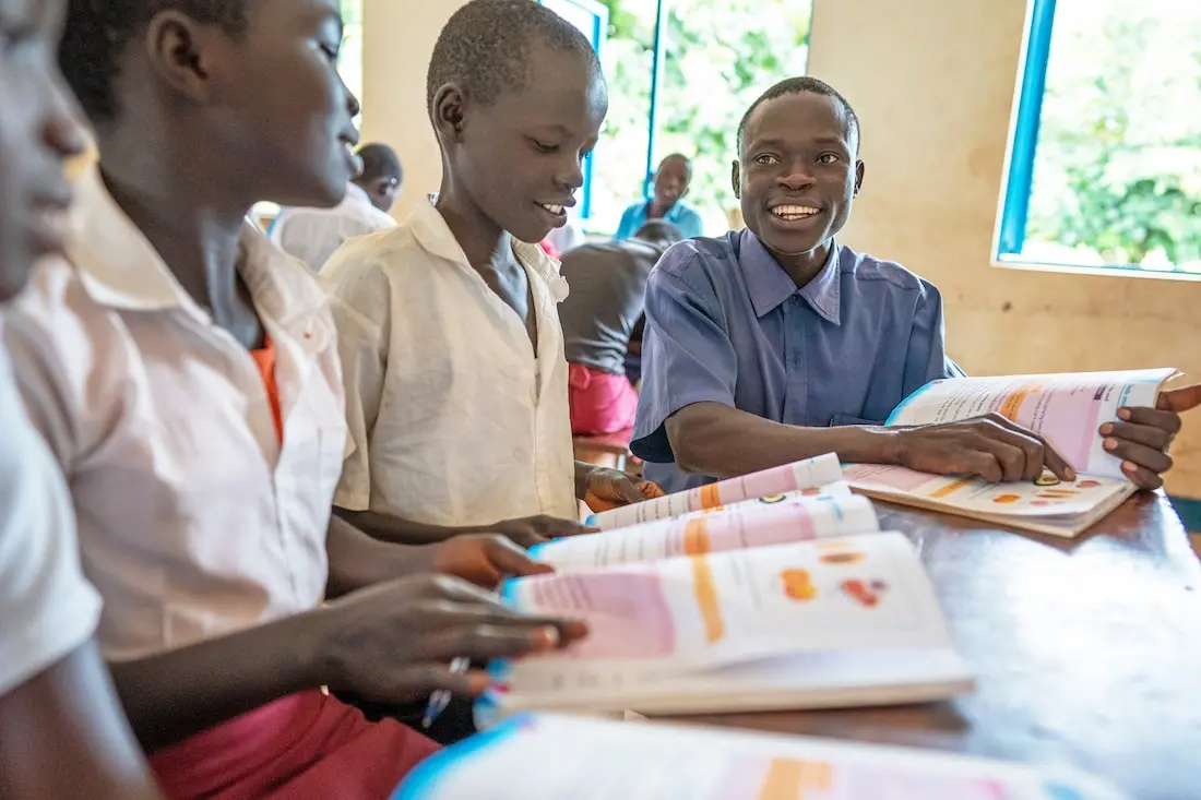 Headmaster James Okech, right, teaches students at Oyere Primary School in Magwi County, South Sudan, one of 18 primary schools that were rehabilitated with support from UNICEF and partners.