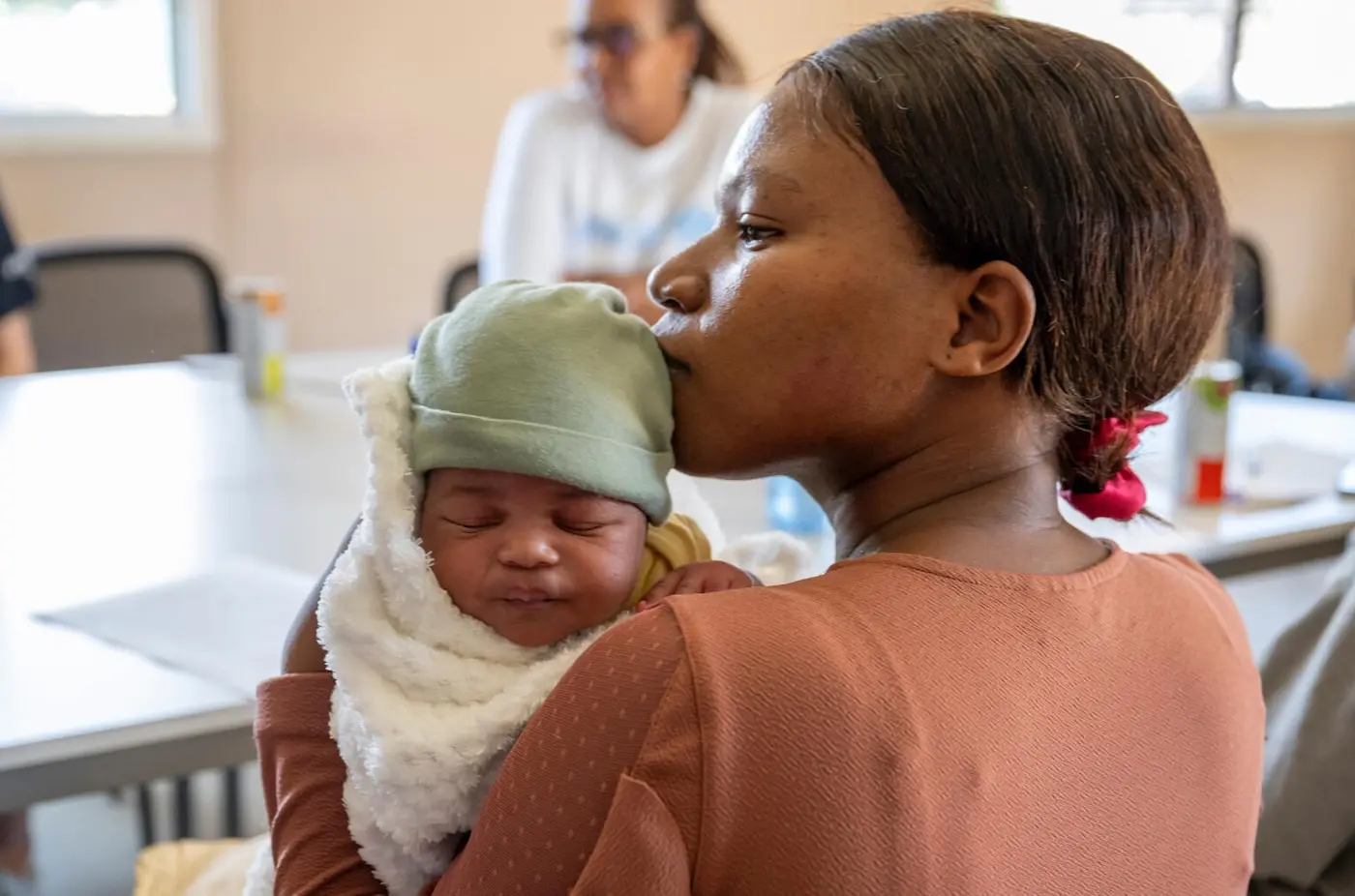 A mother in South Africa holds her newborn baby.