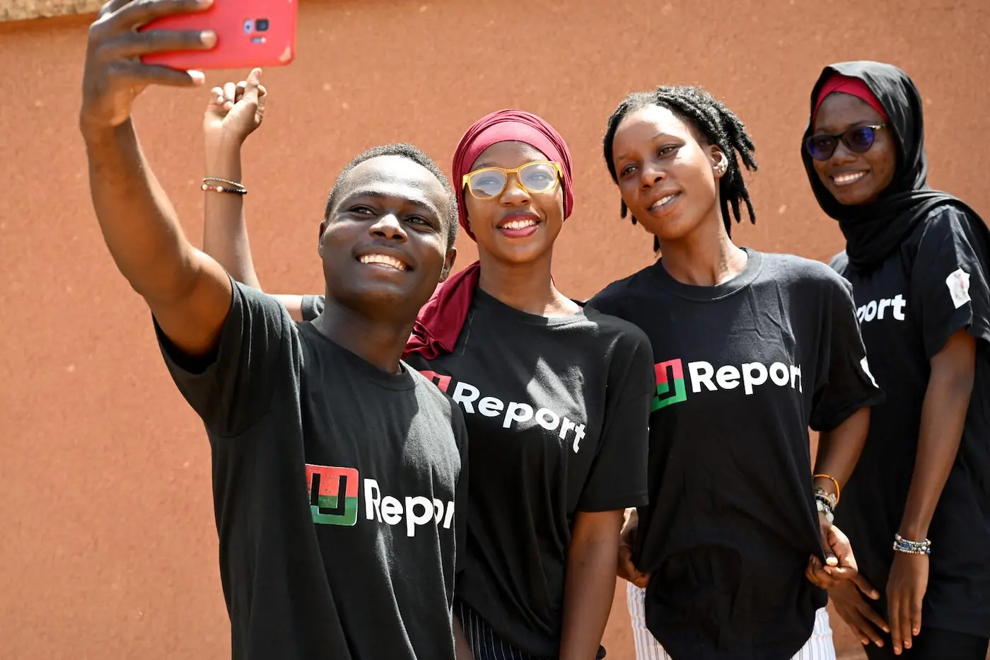 Four young adults take a selfie in Burkina Faso.