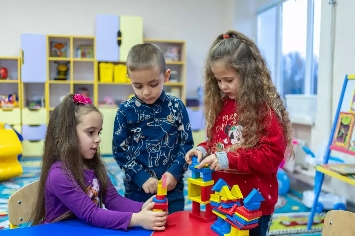 Young children play in a UNICEF-supported developmental class in the village of Petropil, Zaporizhzhia oblast, Ukraine.