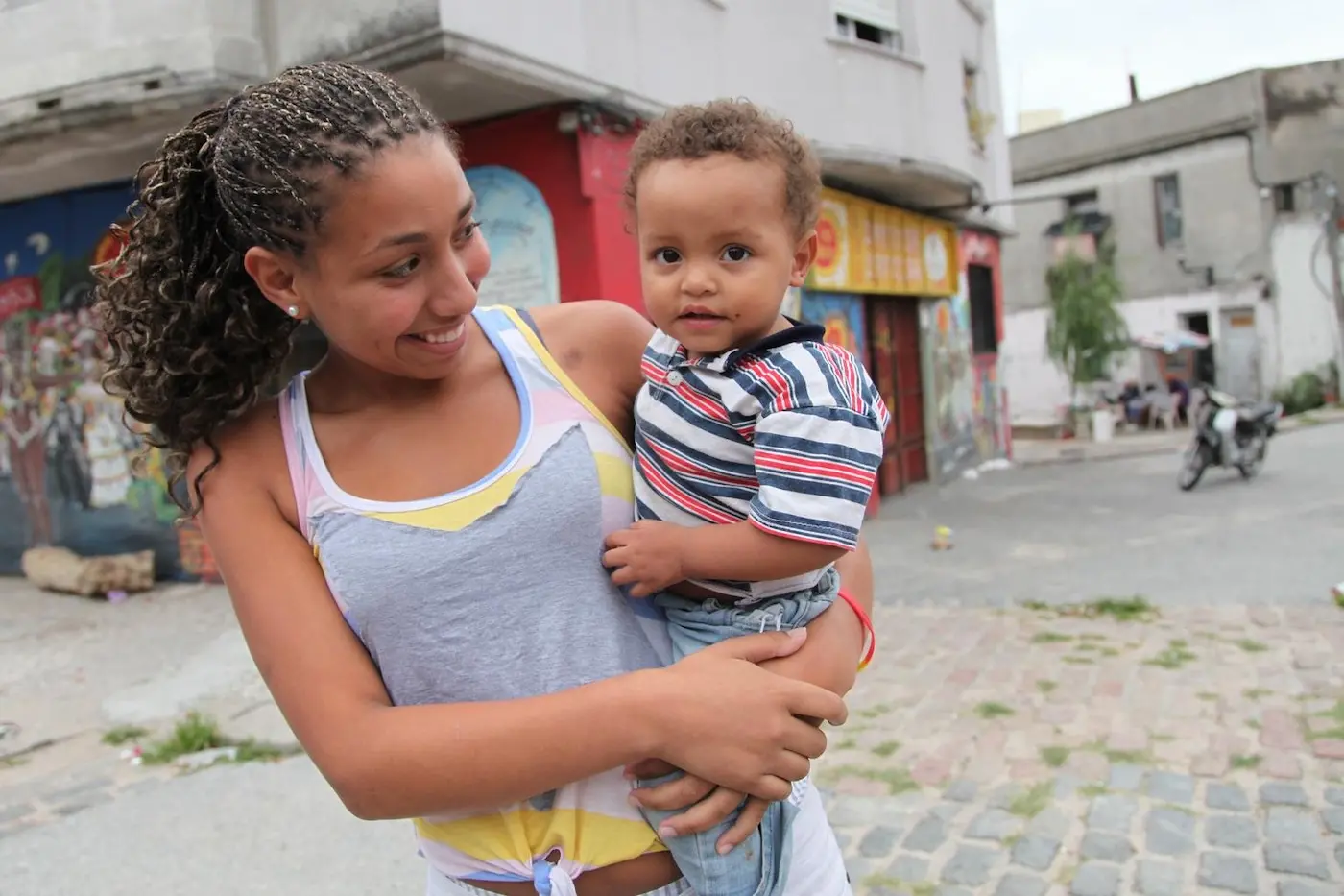 A mother holds her 18-month old son in Uruguay. UNICEF works to ensure all children are safe and protected.