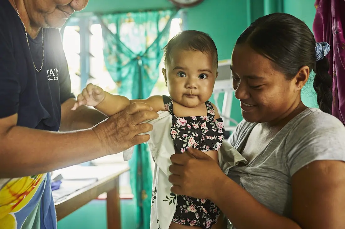 A child is vaccinated at a UNICEF-supported health clinic in Tuvalu.