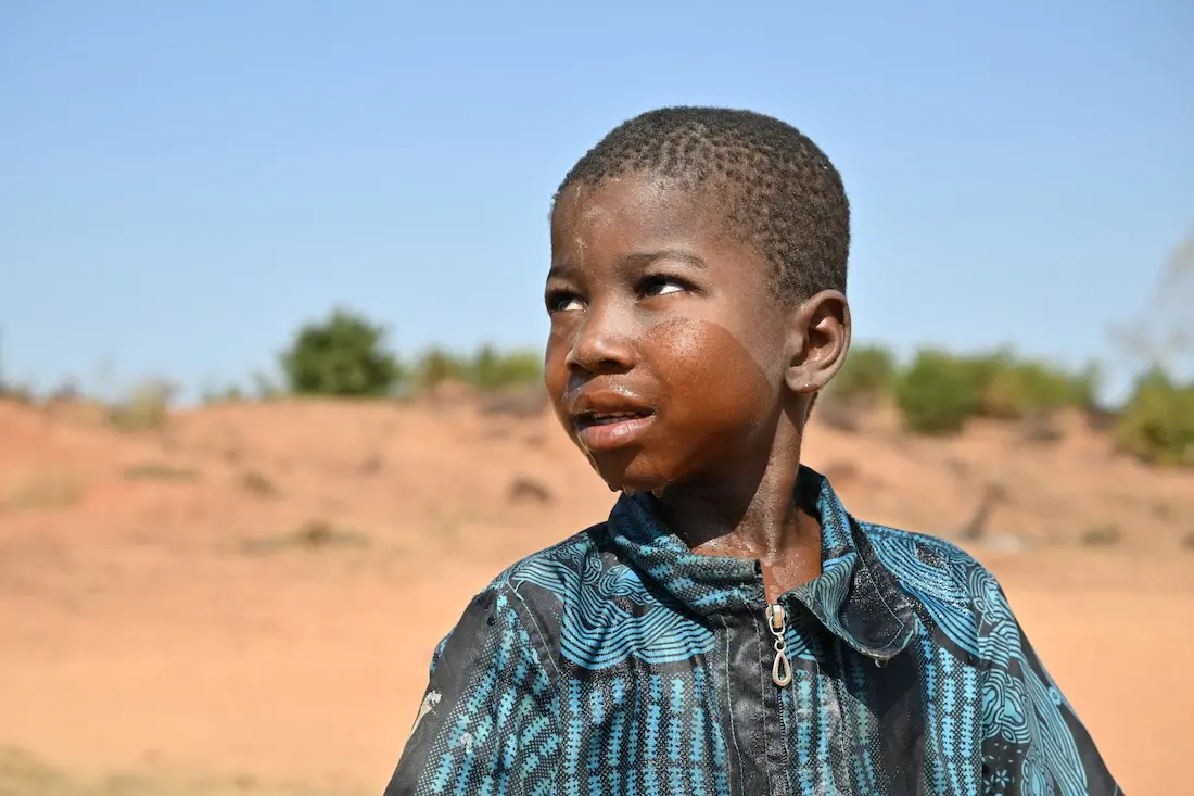 A boy receiving support at a UNICEF child-friendly space in Fada N’gourma, eastern Burkina Faso.