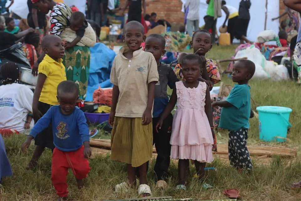 Children at Burundi's Rugombo stadium refugee reception site.