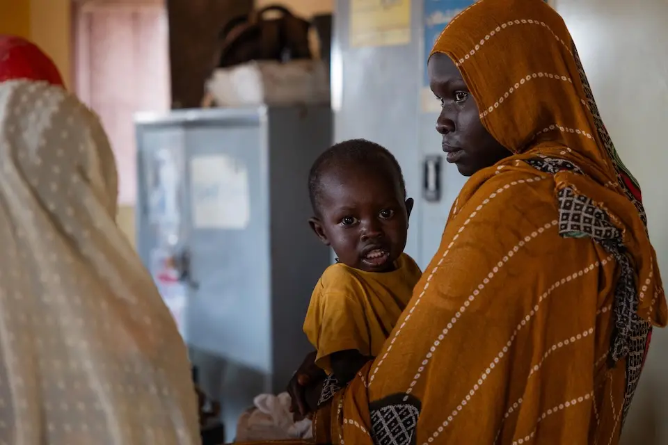A mother with a child receiving nutrition services at a UNICEF-supported clinic in Khartoum state, Sudan.