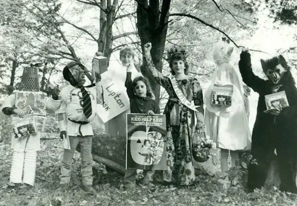Children in costume trick-or-treating for UNICEF