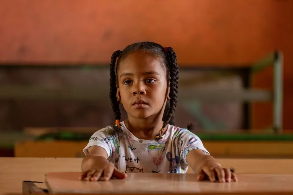 Fatima, 6, sits in an empty classroom at the UNICEF supported Alshargia safe learning space or Makanna in Kassala state, Sudan.