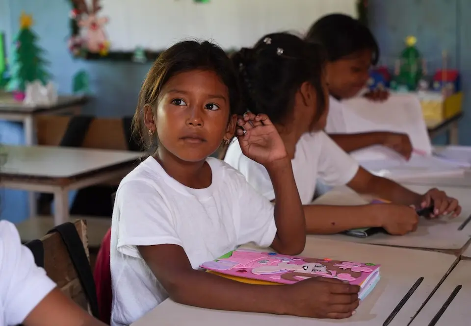 A girl sits at her desk in a UNICEF-supported classroom in Sinamaica Lagoon, Zulia state, Venezuela.