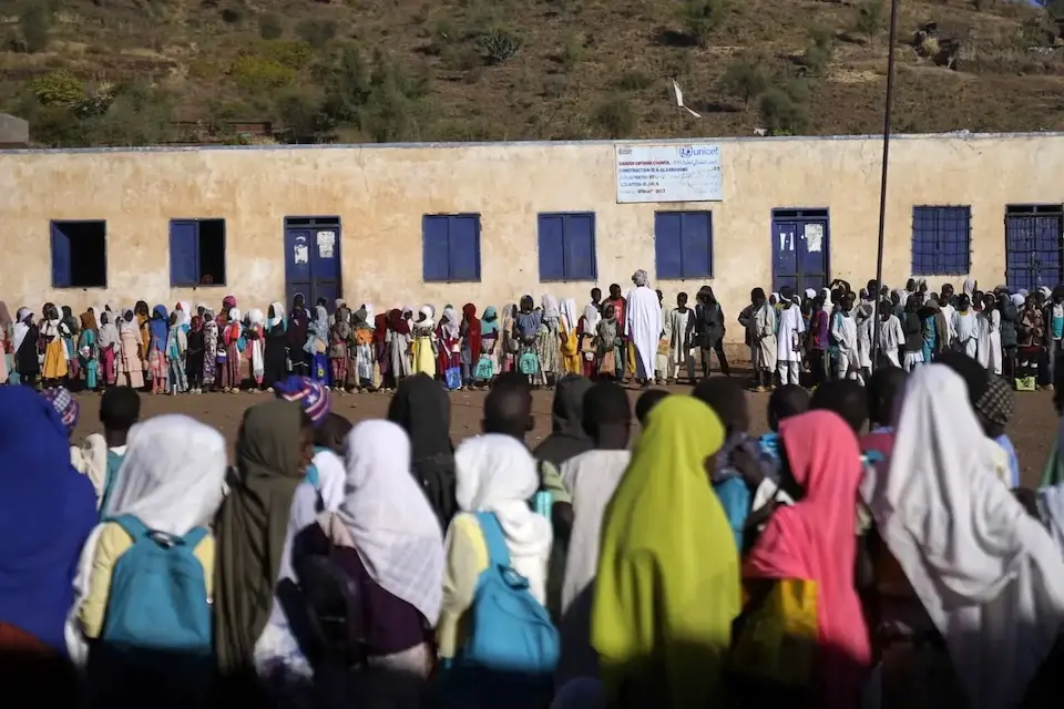 Students gather outside a UNICEF-supported school in Rokero, Central Darfur, Sudan.