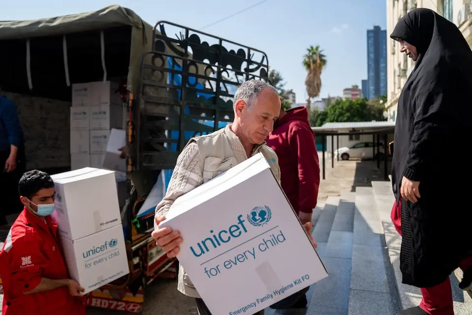 On March 3, 2026, a UNICEF team unloads a truck full of emergency supplies at a shelter in Mount Lebanon for families displaced by escalating conflict.