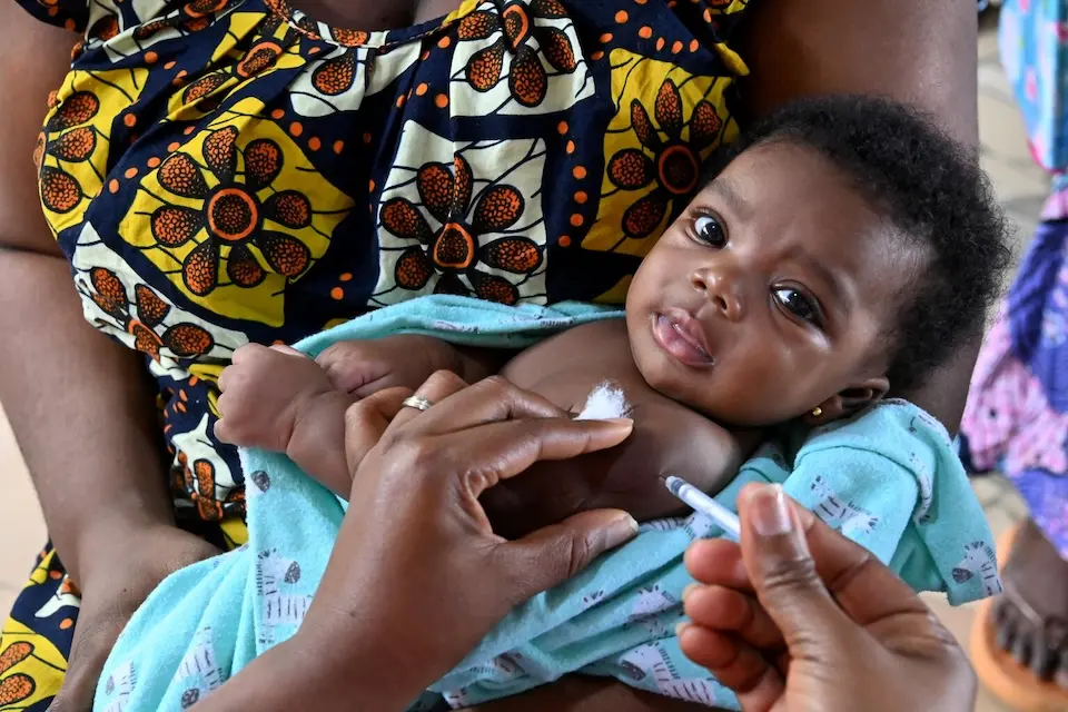 A baby is being vaccinated for malaria in Côte d’Ivoire.