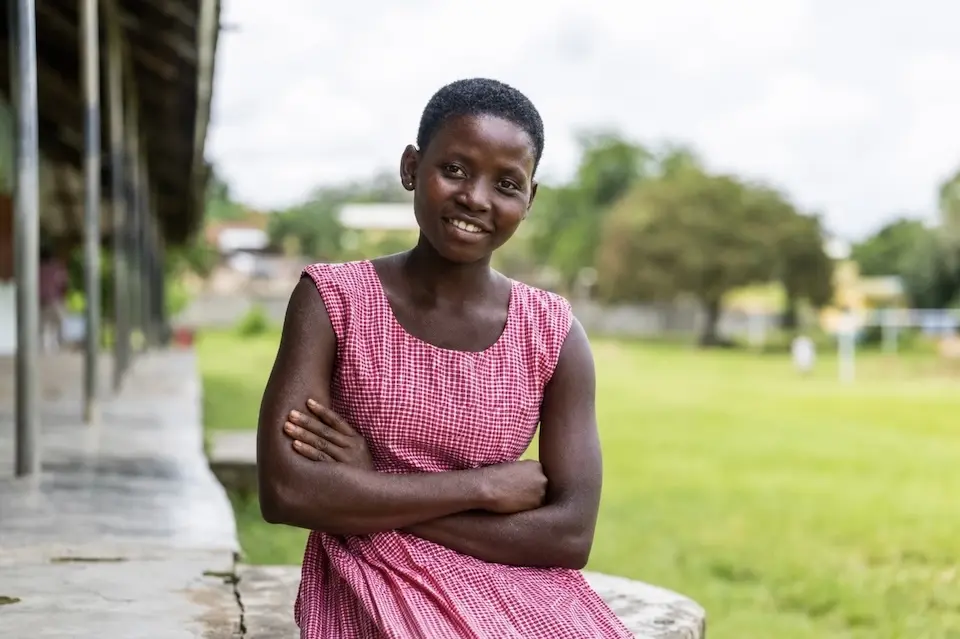 Elizabeth, 16, of Ghana, returned to school after giving birth to her daughter with help from UNICEF.