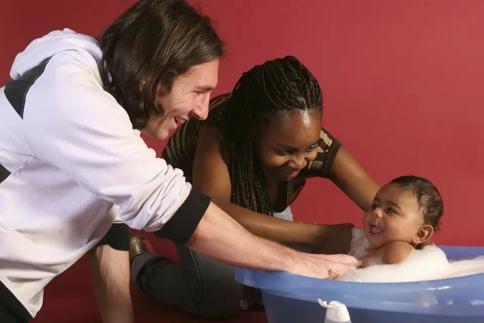 Lionel Messi with baby Lamine Yamal (in bathtub) and his mother, Sheila Ebana in 2008.