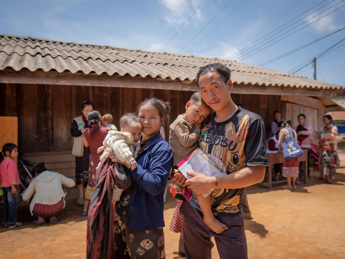 TOP PHOTO: LiXong and her husband bring their children to receive polio vaccinations at an outreach point in Song Nuea Village, Lao People’s Democratic Republic. 