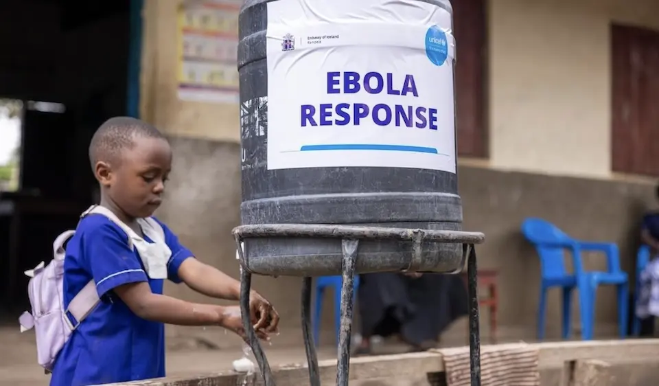 A young girl uses a handwashing station provided by UNICEF in Uganda. 