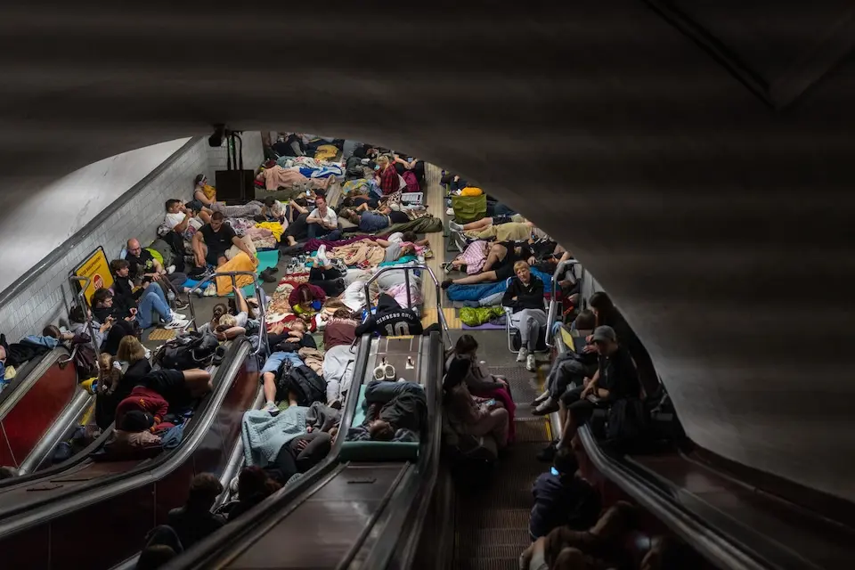Families shelter from overnight attacks inside a Kyiv metro station on July 30, 2026.