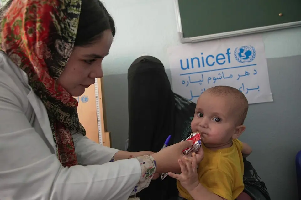 On June 30, 2026, a 15-month-old boy receives ready-to-use therapeutic food at Nawabad Clinic in Herat province, Afghanistan.